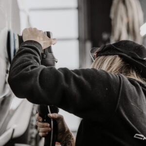 Paint correction tools and polishing equipment used inside the Carsmotology detailing studio.