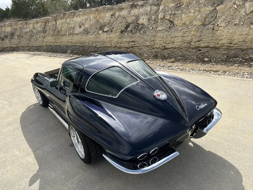 Classic split window Corvette restomod rear three-quarter view after paint correction and ceramic coating by Carsmotology in Boerne, Texas