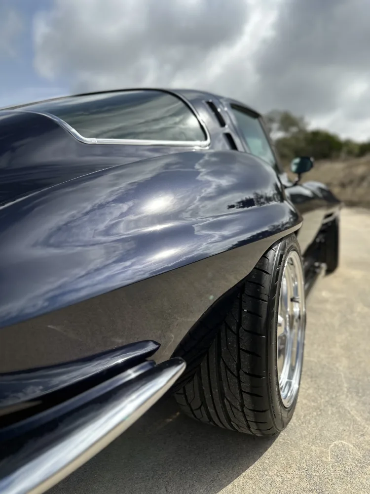 Ceramic coated rear fender of split window Corvette reflecting clouds with high gloss finish