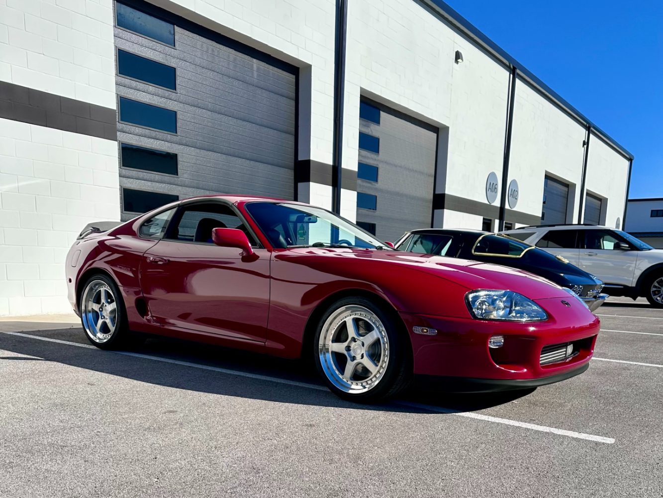 MK4 Supra Ceramic Coating Finish in Direct Sunlight Red Toyota Supra MK4 ceramic coated after paint correction process