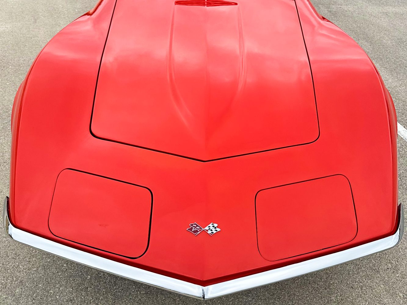 Monza Red Corvette Single-Stage Paint Correction – Hood Restoration Overhead view of Monza Red Chevrolet Corvette after single-stage paint correction