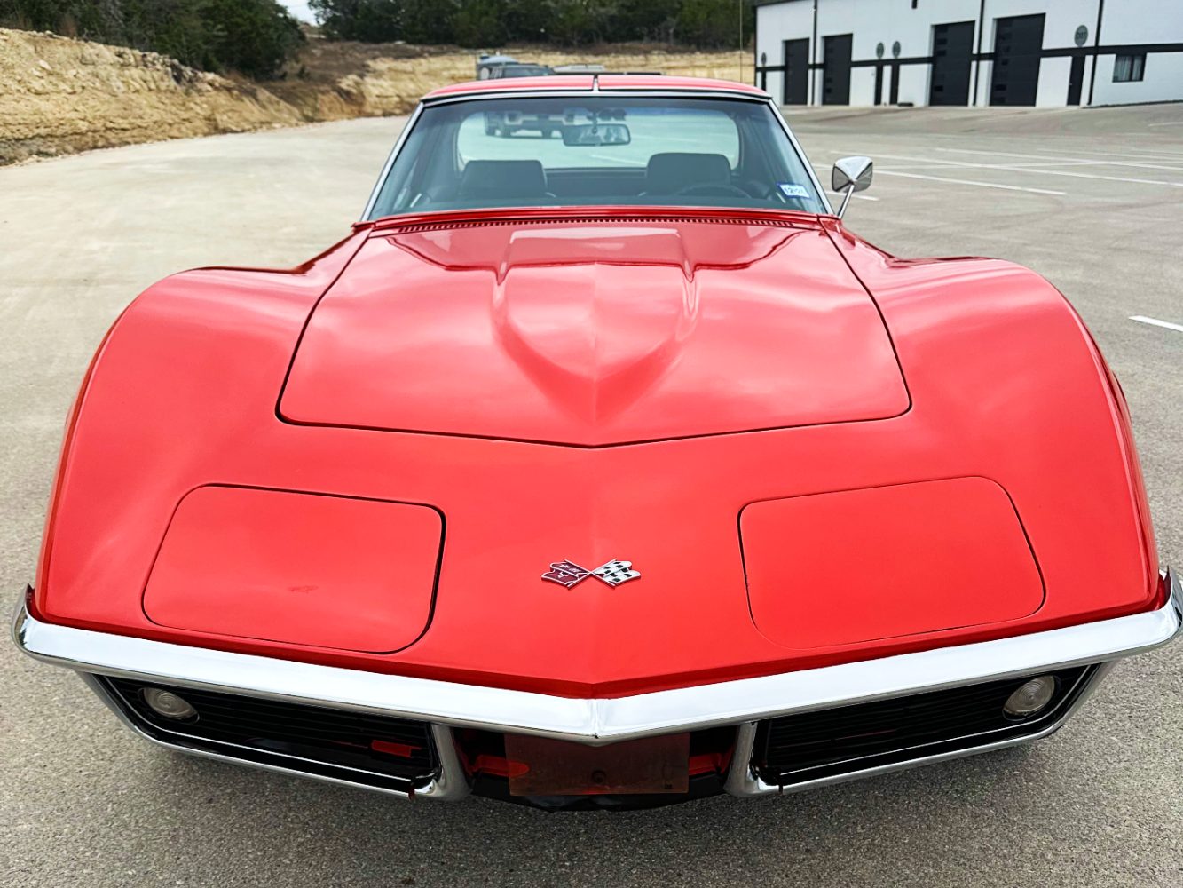 Single-Stage Corvette Front-End Paint Refinement Front view of classic red Corvette after preservation-focused paint correction