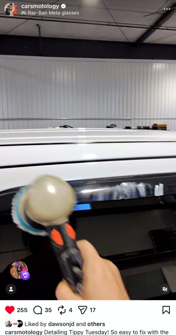 Detailer using a polishing tool to remove defects from vehicle window trim.