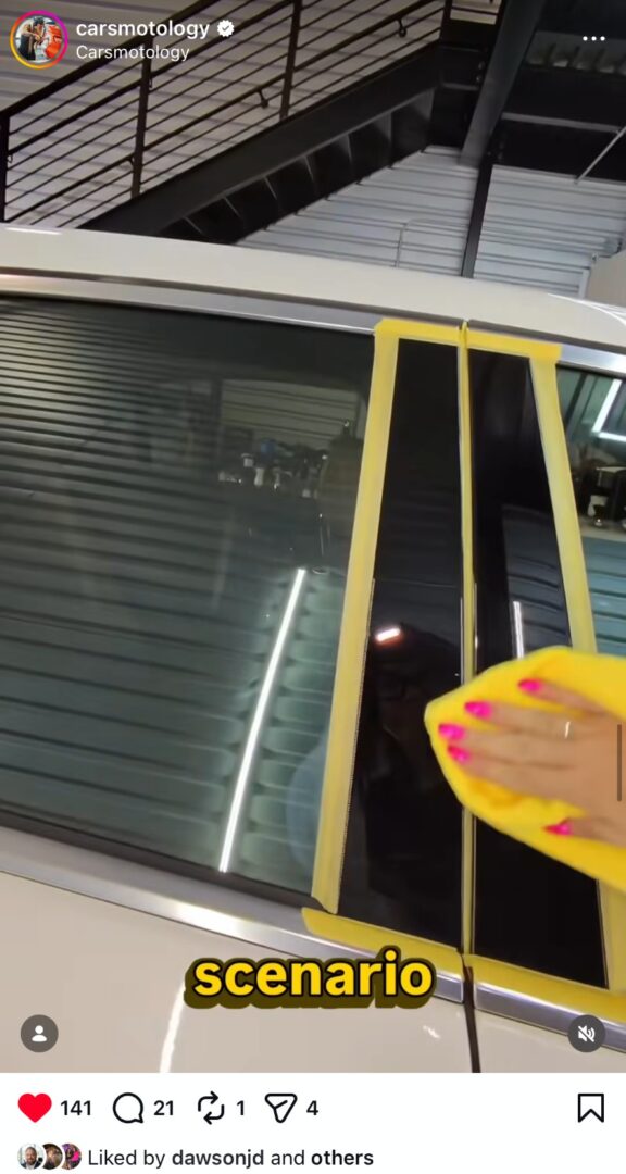 Cleaning vehicle trim and window pillars during exterior detailing.