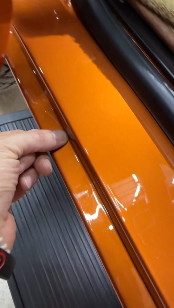 Paint protection film applied along the lower rocker and body edge of the custom Bronco to guard against road debris