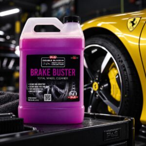 P&S Brake Buster Non Acid Wheel Cleaner gallon jug beside a yellow Ferrari wheel