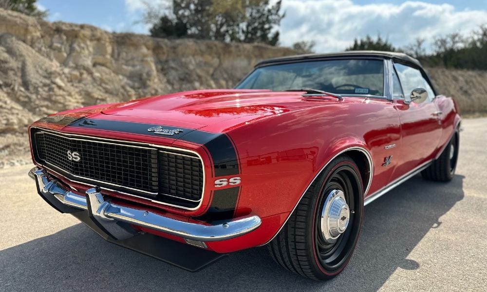 Red 1967 Chevrolet Camaro SS/RS convertible restomod with a glossy paint-corrected and ceramic-coated finish, detailed by Carsmotology in Boerne, TX